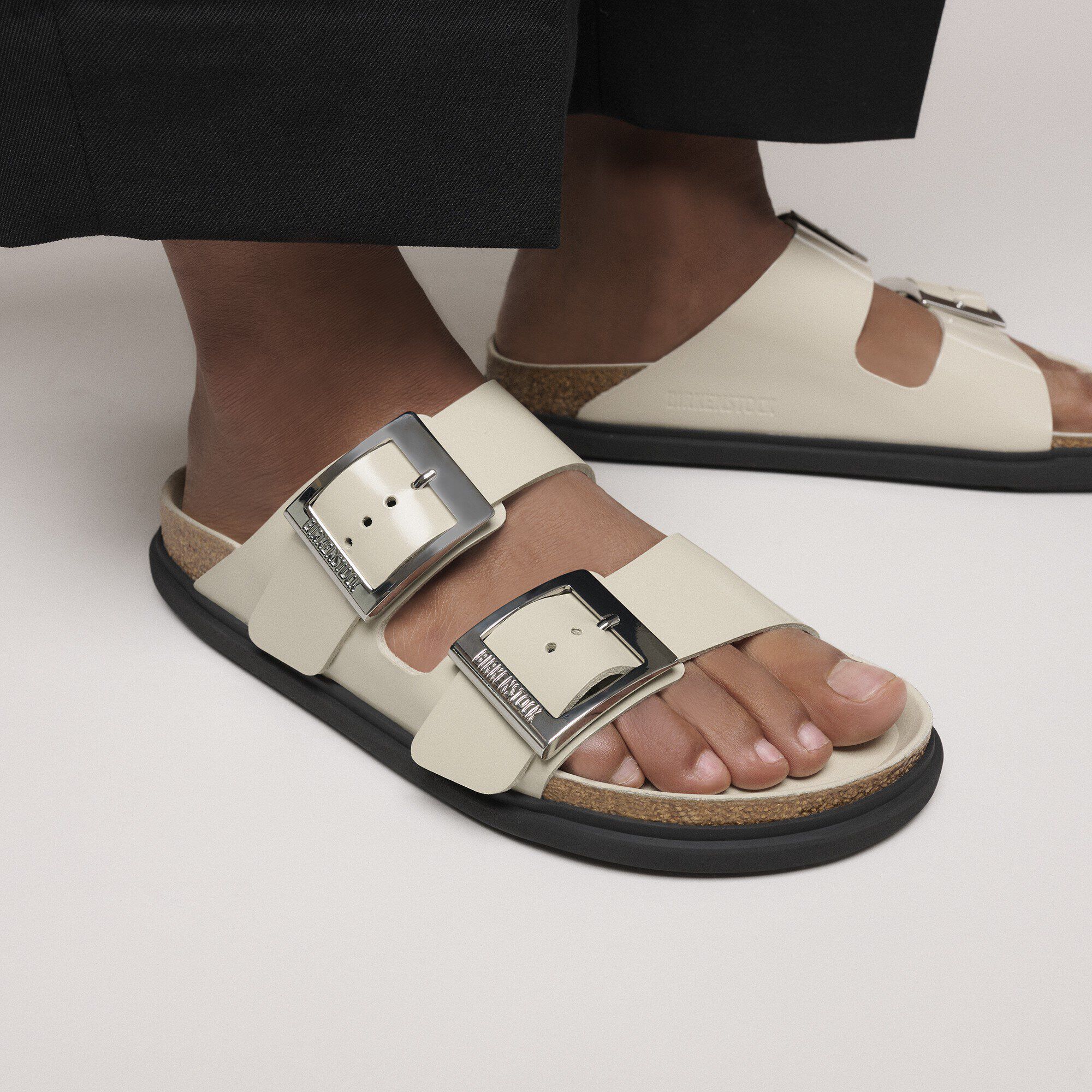 Arizona Droplet Buckle Natural Leather Patent Close-up with a female model