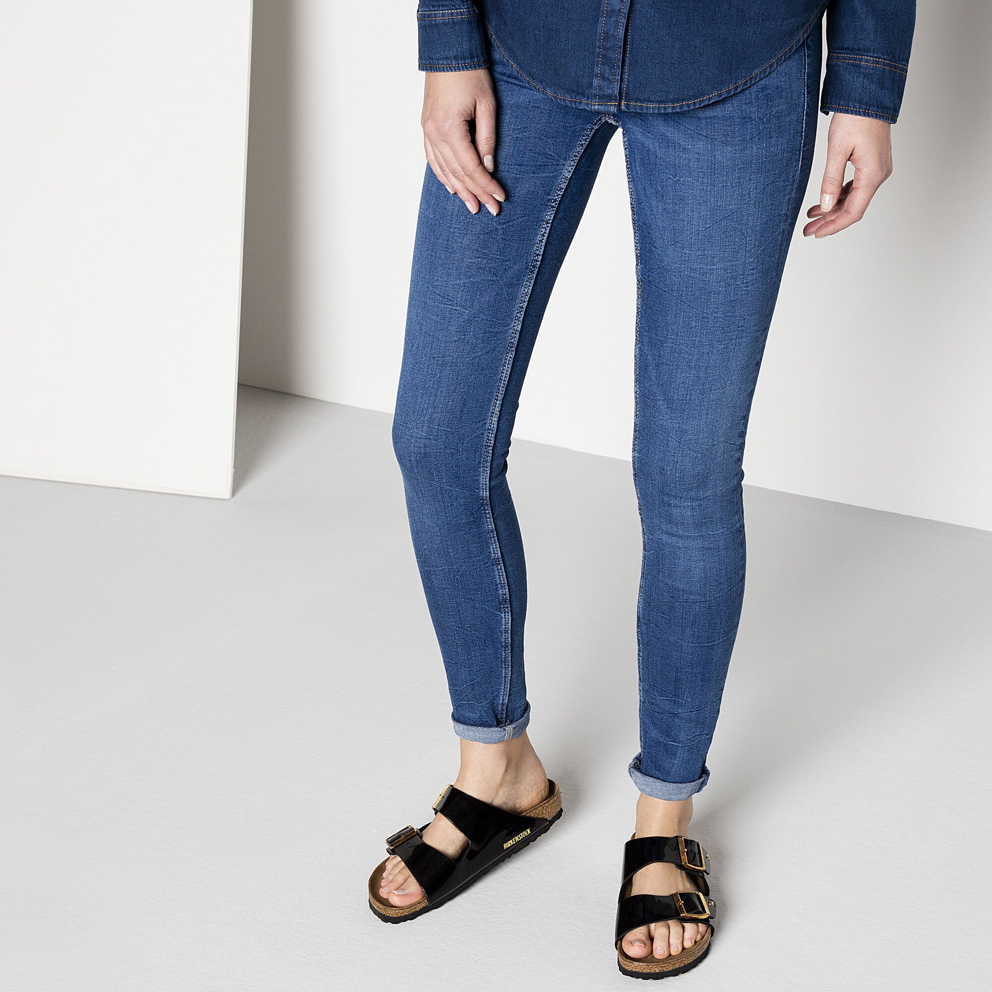 black patent birkenstocks with gold buckle