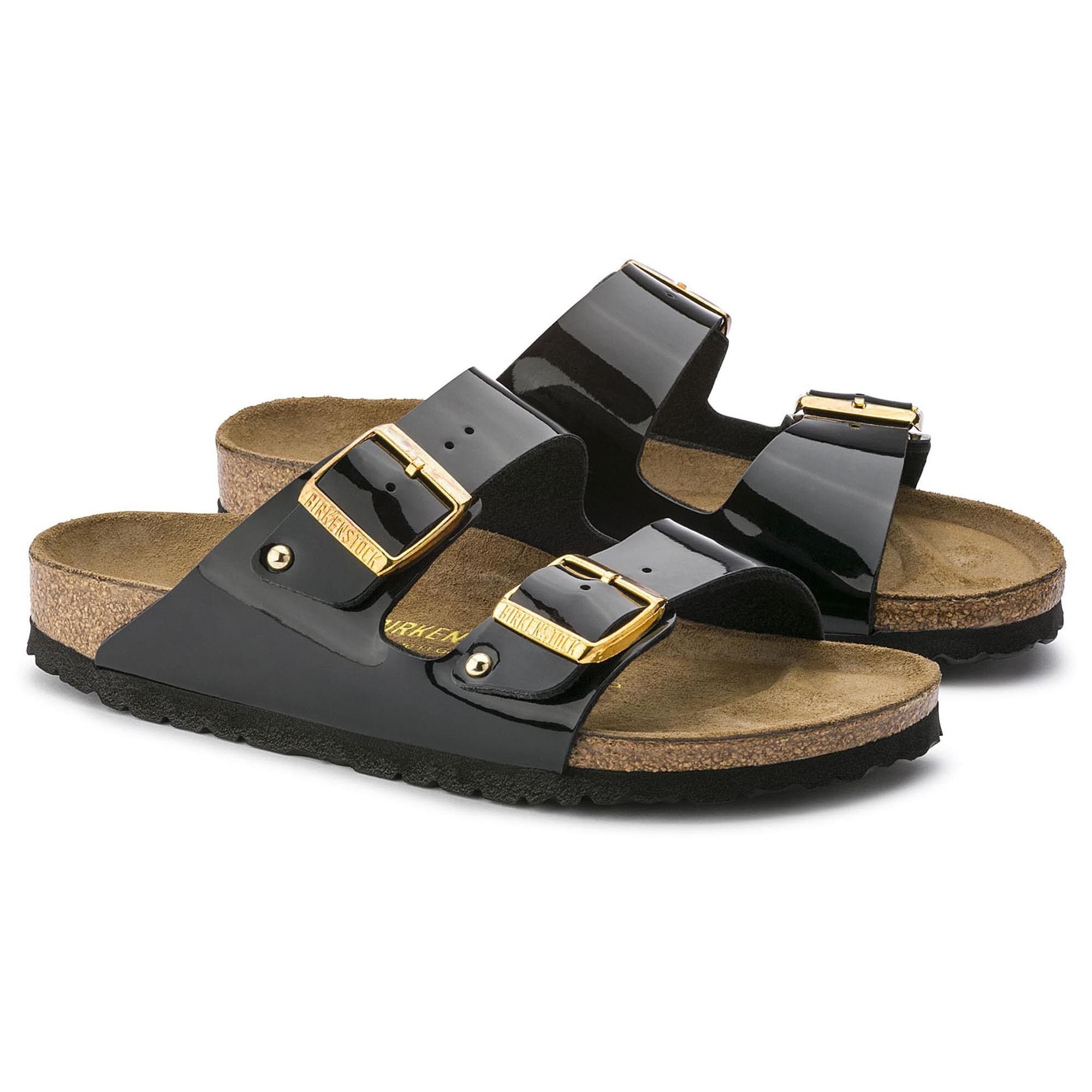 black patent birkenstocks with gold buckle