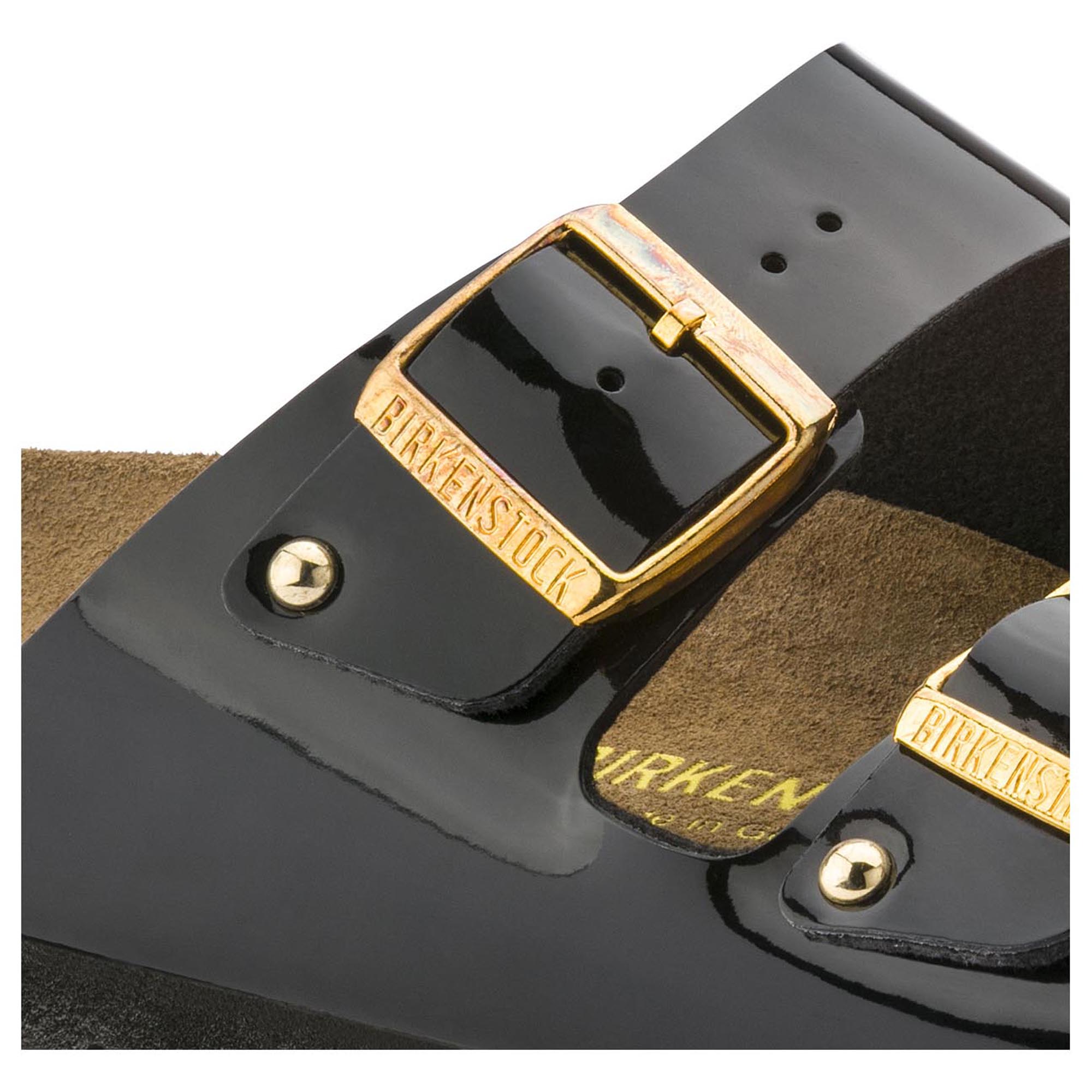 black patent birkenstocks with gold buckle